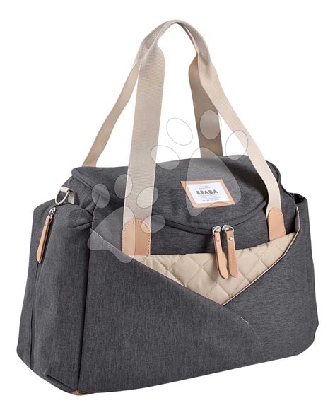 Detailní záběr přebalovací tašky Stokke Black Melange s otevřenými kapsami a viditelnou přebalovací podložkou