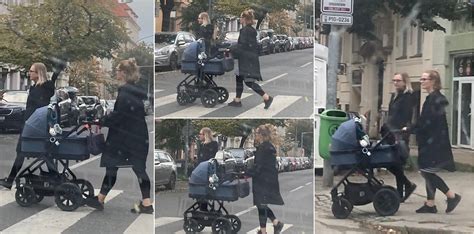 Žena s miminkem v kočárku na procházce